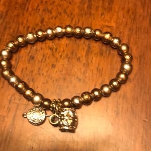 Metal beaded bracelet with charms